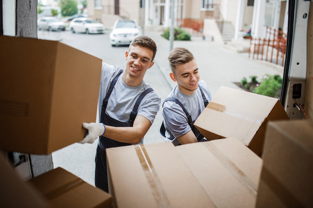 Professional Movers Doing Home Relocation Services.