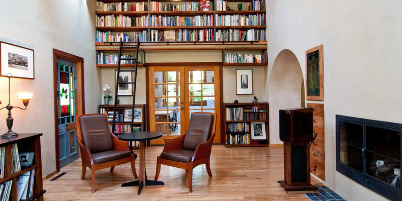 A Mini Home Library With Collection Of Books Arranged In Racks.