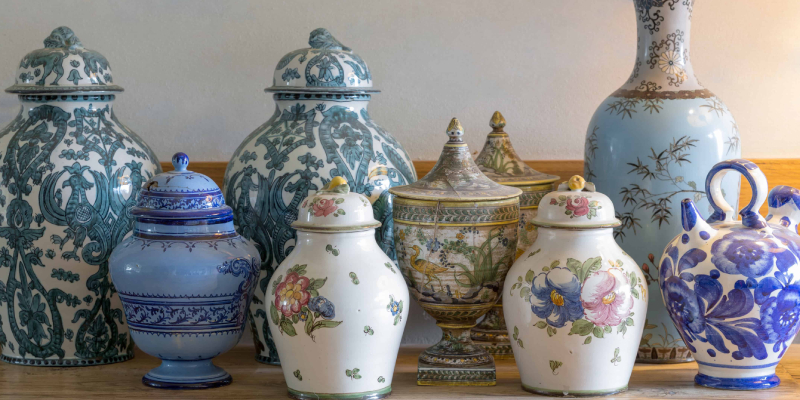 Collection Of Glass Vessels Arranged On The Table.