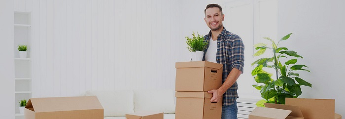 A man ready for shifting with his packed office stuff